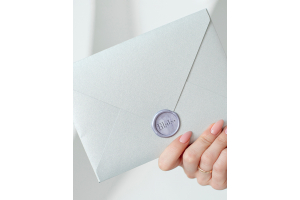 How can I seal an envelope?